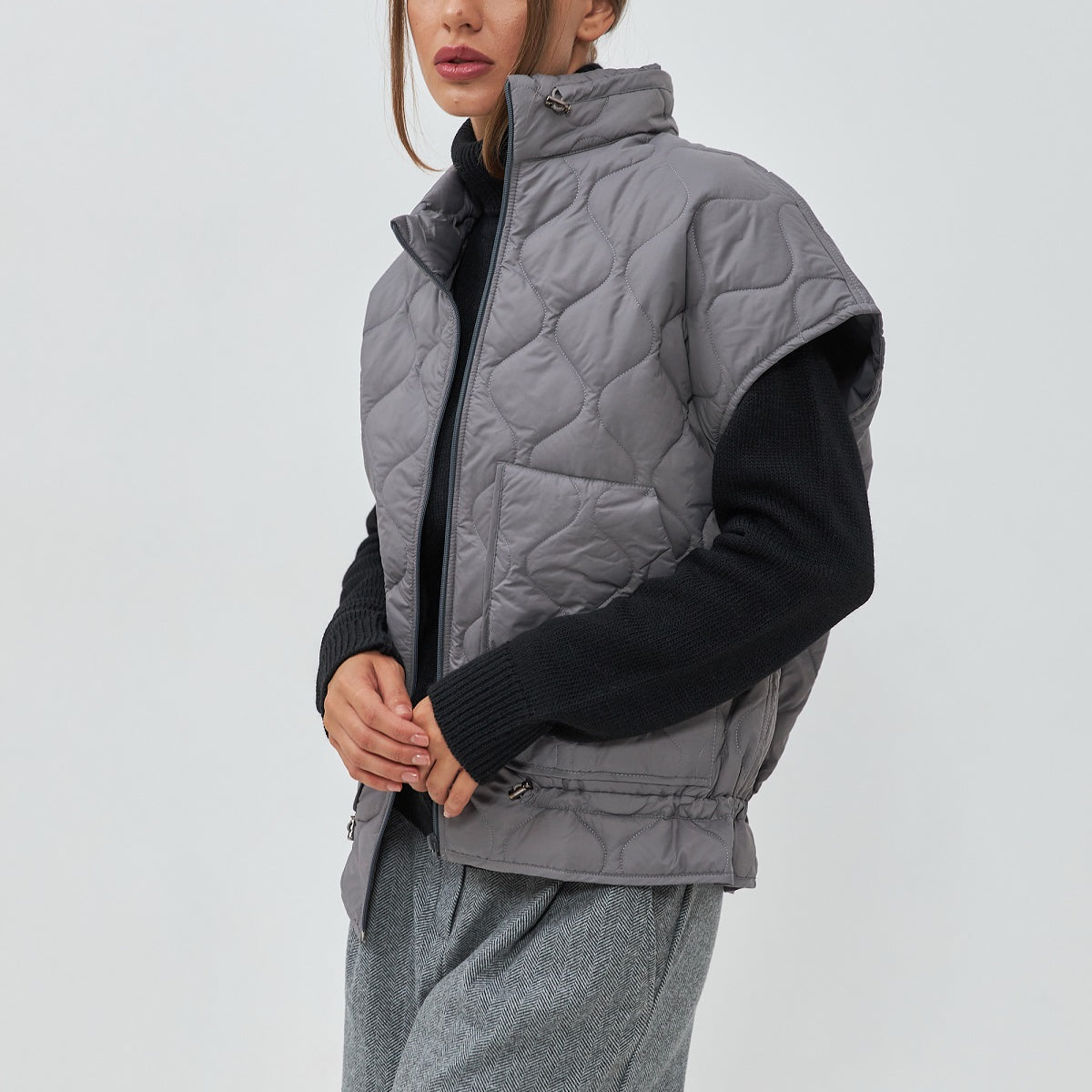 Жилет стьобаний з накладними кишенями