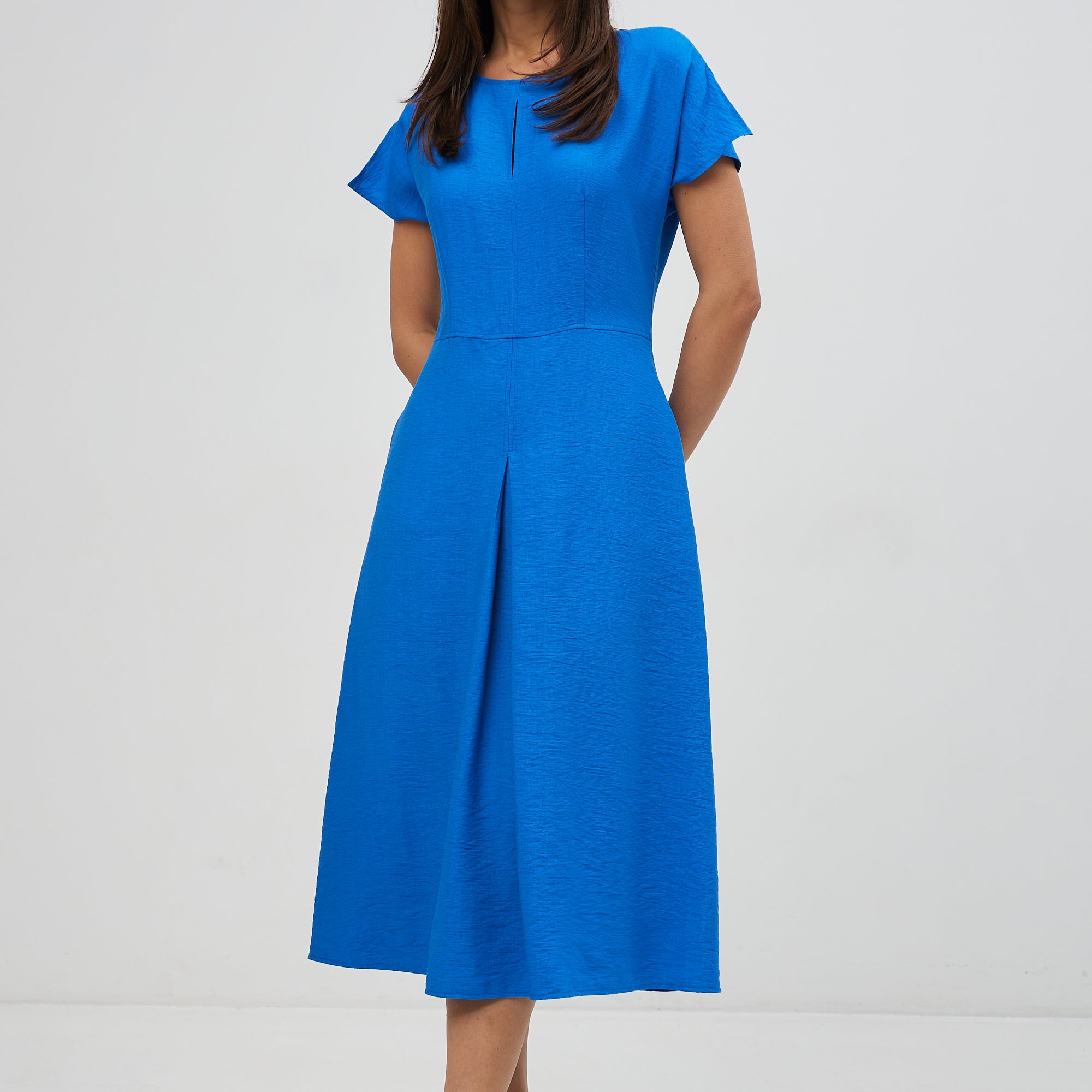 Сукня зі складою на спідниці